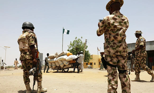 Soldiers stand guard at the boarder in Gamboru Ngala, Borno, Nigeria, in this April 27, 2017 photo. (REUTERS)