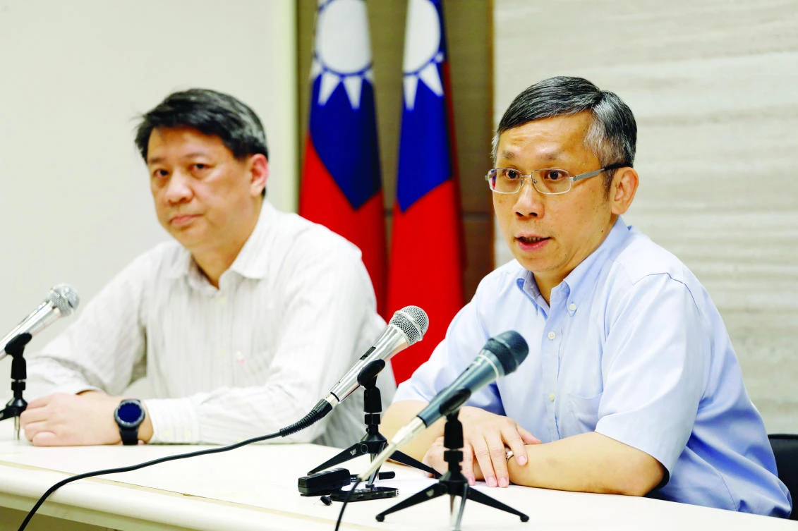 Taiwan’s Office of International Cooperation director, Hsu Ming-hui, right, talks during a news conference in Taipei, on Monday. (Reuters)