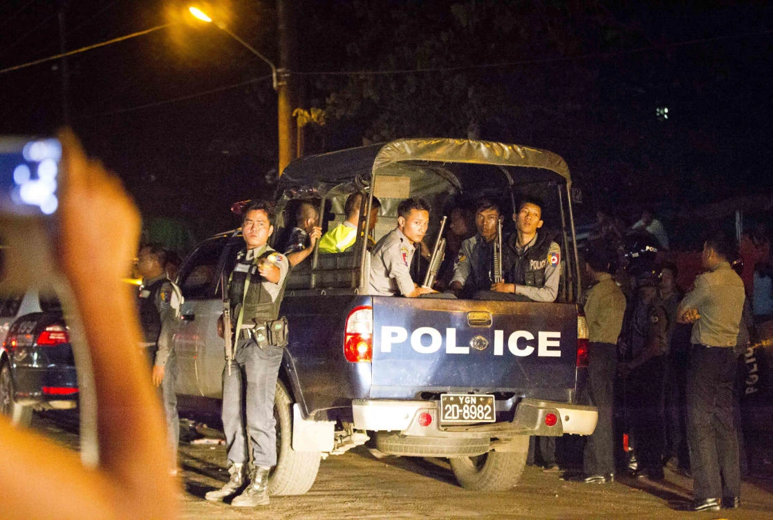 Myanmar police officers provide security on a road in Mingala Taungnyunt township where Buddhist hard-liners confront with Muslim community in Yangon, Myanmar. (AP)