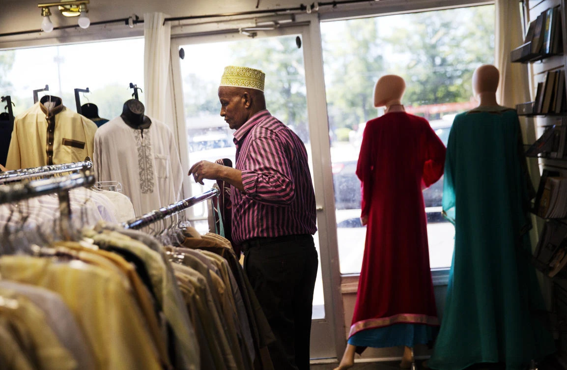 Mohamoud Saed, a refugee from Somalia, helps out in a friend's clothing store in Clarkston, Ga. (AP)