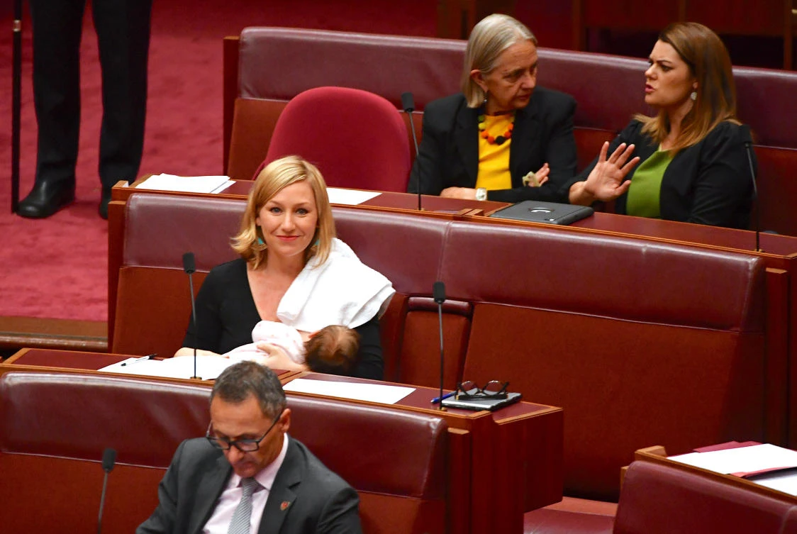 Australian Senator Larissa Waters breastfeeds her baby in the Senate Chamber at Parliament House in Canberra, Australia. (AAP/Mick Tsikas/via Reuters)