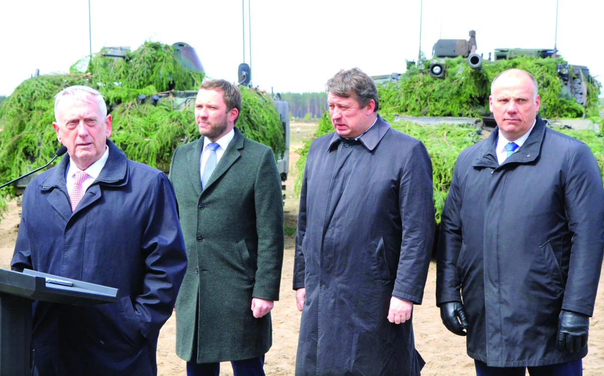 US Defense Secretary James Mattis, left, stands with the defense ministers of Estonia, Lithuania, and Latvia as they meet with US troops deployed in Lithuania at the General Silvestras Zukauskas Training Area in Pabrade on Wednesday. (AFP)