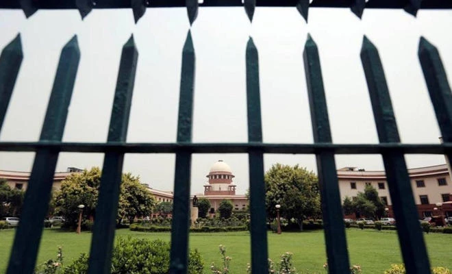 India's Supreme Court is pictured through a gate in New Delhi, India, on May 26, 2016. (REUTERS/Anindito Mukherjee)