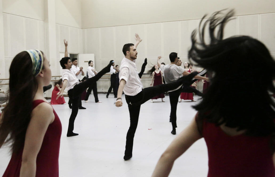 Fady el-Nabarawy, center, practices during a rehearsal at the Cairo Opera House, Egypt. (AP)