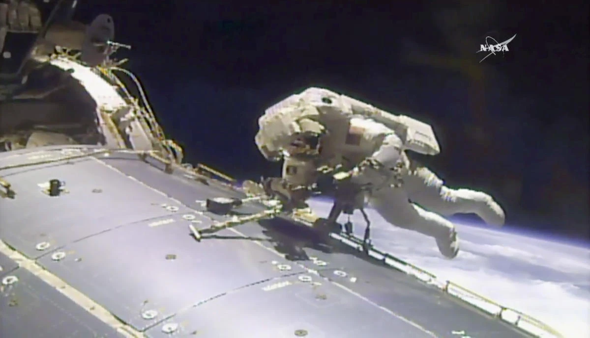 In this image made from video provided by NASA, astronaut Jack Fischer works outside the International Space Station on Friday, May 12, 2017. (NASA via AP)