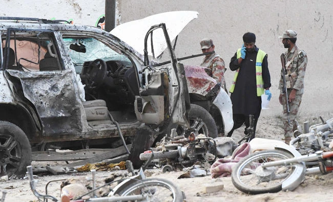 Pakistani security officials examine the site of a suicide bomb attack in Mastung district, some 50kms south of provincial capital Quetta. (AFP)