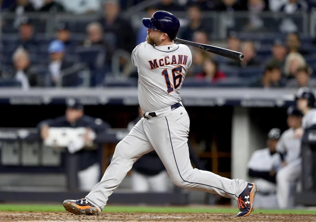 Brian McCann (16) of the Houston Astros hits a three run home run in the fourth inning against the New York Yankees at the Yankee Stadium in the Bronx borough of New York City on Friday night. (AFP)