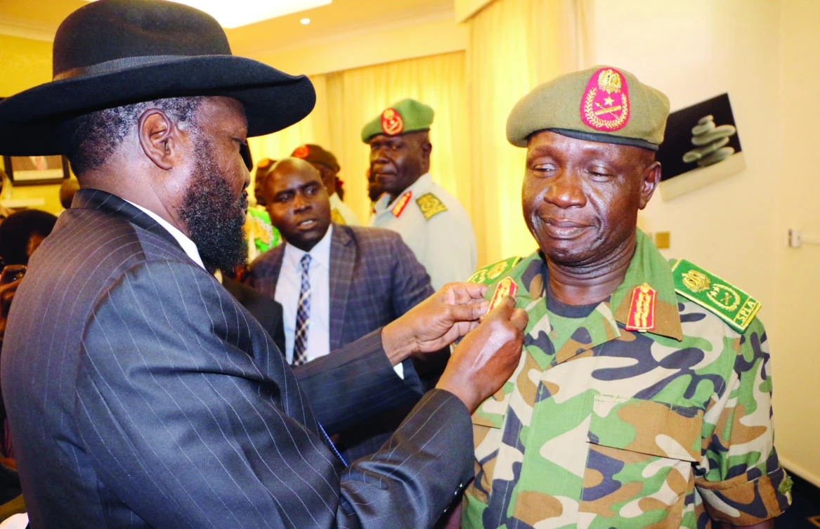 South Sudan’s President Salva Kiir decorates General James Ajongo, newly appointed army chief, during his swearing-in ceremony in Juba on Wednesday. (Reuters)