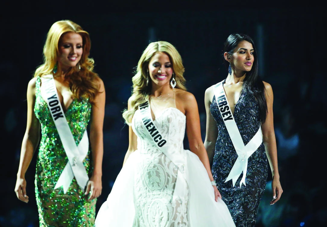Miss New Jersey USA Chhavi Verg, right, competes during a preliminary competition for Miss USA in Las Vegas. Very emigrated from India with her parents. (AP)