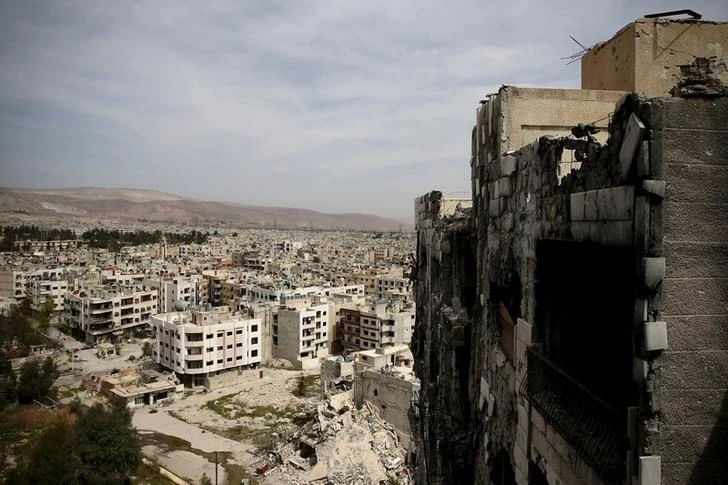 A general view shows damaged buildings as seen from the rebel held Qaboun neighborhood of Damascus, Syria March 13, 2016. (REUTERS)