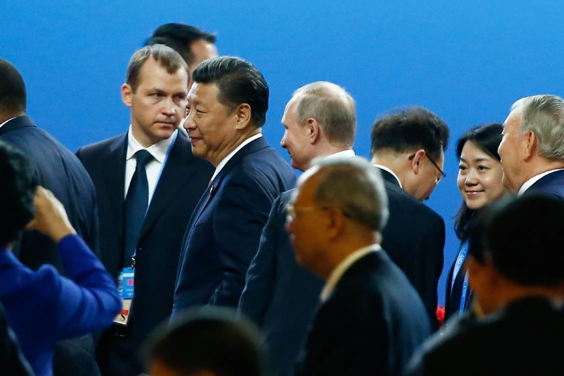 China's President Xi Jinping (centre L) and his Russian counterpart Vladimir Putin (centre R) leave the opening ceremony of the Belt and Road Forum in Beijing on May 14, 2017. China opened on May 14 a summit to promote an ambitious global trade infrastructure project highlighting its growing leadership on globalisation, but a North Korean missile test threatened to overshadow the event. (AFP)