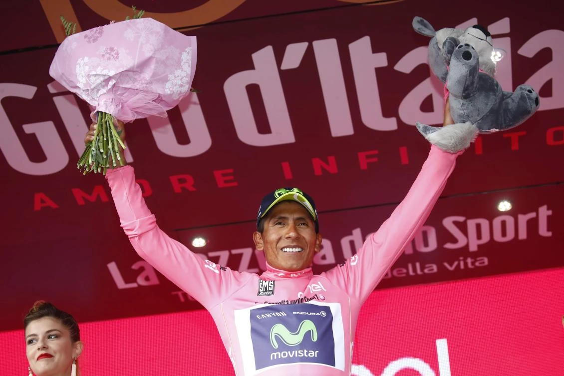 Colombia's Nairo Quintana of team Movistar celebrates the pink jersey of the overall leader on the podium after winning the 9th stage of the 100th Giro d'Italia, Tour of Italy, cycling race from Montenero di Bisaccia to Blockhaus on Sunday. (AFP)