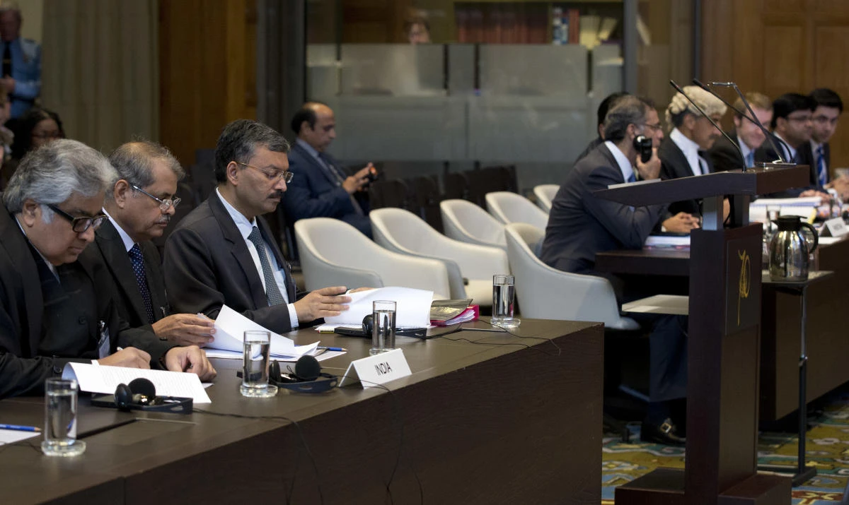 Delegations of India, left, and Pakistan, right, wait for judges to enter the World Court in The Hague, Netherlands, Monday, May 15, 2017. India is taking Pakistan to the United Nations' highest court in an attempt to save the life of an Indian naval officer sentenced to death last month by a Pakistani military court after being convicted of espionage. (AP)