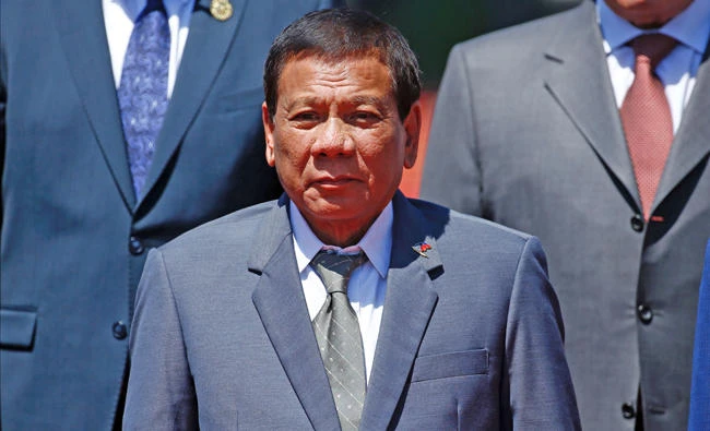 Philippine President Rodrigo Duterte poses for a family photo with other leaders during the Belt and Road Forum, at the International Conference Center in Yanqi Lake, north of Beijing, on Sunday. In Manila, lawmakers killed an impeachment complaint accusing Duterte of crimes against humanity for the thousands of people who have died in his anti-drug crackdown. (AFP / POOL / DAMIR SAGOLJ)