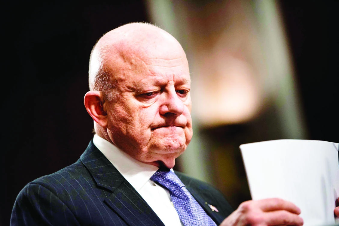 James Clapper, former director of National Intelligence, organizes his papers during a hearing of the Senate Armed Services Committee in Washington. (AFP)