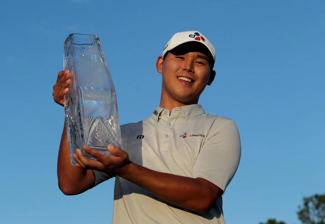 Si-Woo Kim hoists the trophy after winning The Players Championship golf tournament at TPC Sawgrass Stadium Course on Sunday. (USA TODAY Sports)