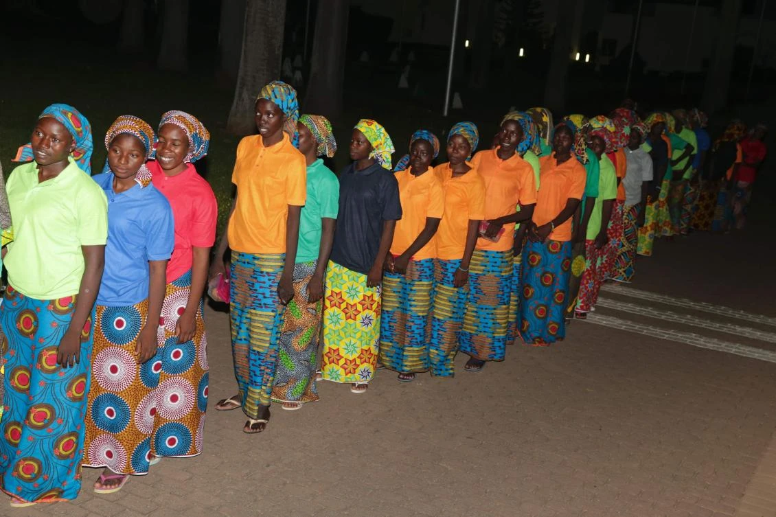 An handout picture released by the PGDBA&HND Mass Communication shows some of the 82 released Chibok girls waiting before a meeting with Nigeria's President at the Presidential Villa in Abuja, on May 7, 2017. Eighty-two of the more than 200 schoolgirls kidnapped by Boko Haram in northeast Nigeria in 2014 arrived in Abuja on May 7, 2017 to meet President Muhammadu Buhari after a prisoner swap deal secured their release. Presidency spokesman Femi Adesina said the schoolgirls from Chibok, in Borno state, were met at the capital's airport by Buhari's chief of staff Abba Kyari and taken to a medical facility for checks. - "AFP PHOTO / HO / PGDBA&HND MASS COMMUNICATION/SUNDAY AGHAEZE" - NO MARKETING NO ADVERTISING CAMPAIGNS - DISTRIBUTED AS A SERVICE TO CLIENTS / AFP / PGDBA&HND Mass Communication / SUNDAY AGHAEZE / "AFP PHOTO / HO / PGDBA&HND MASS COMMUNICATION/SUNDAY AGHAEZE" - NO MARKETING NO ADVERTISING CAMPAIGNS - DISTRIBUTED AS A SERVICE TO CLIENTS