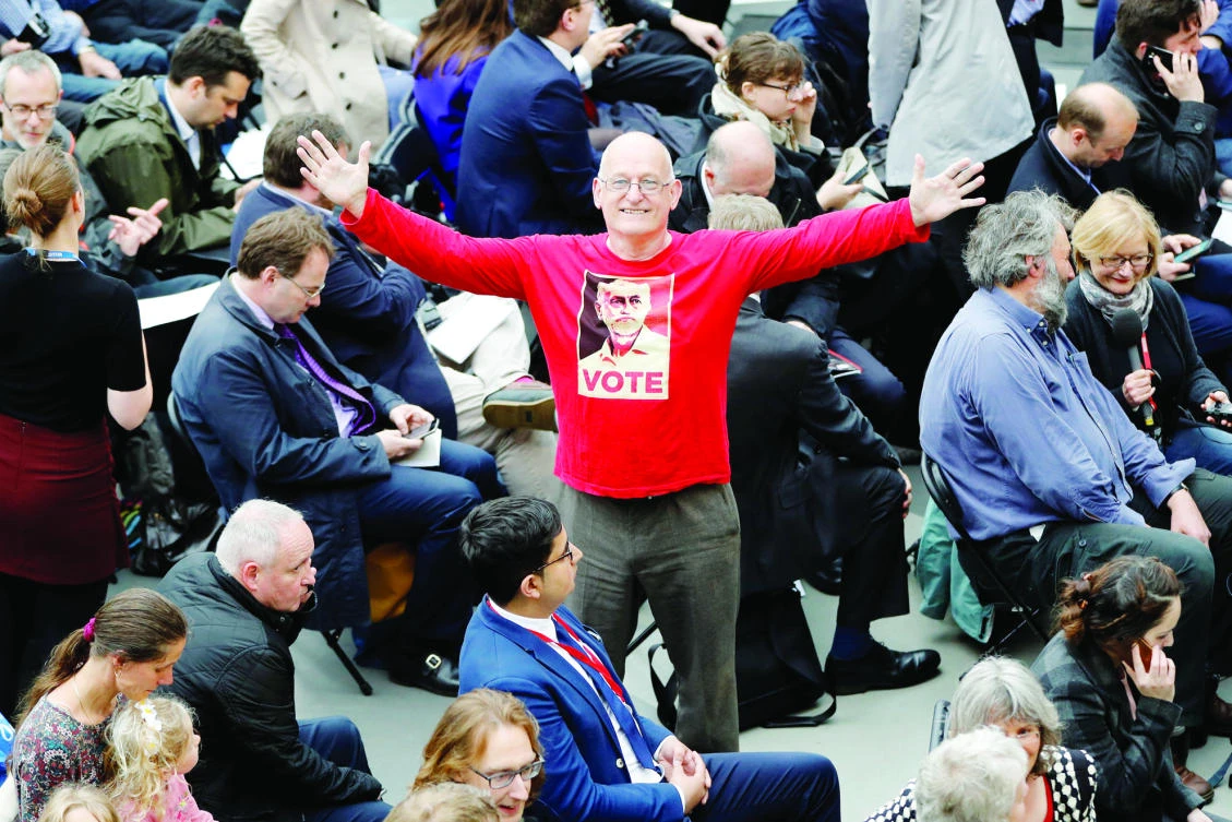 A supporter of Jeremy Corbyn, leader of Britain’s Labour Party, shows off his shirt at the party’s manifesto launch in Bradford. (Reuters)