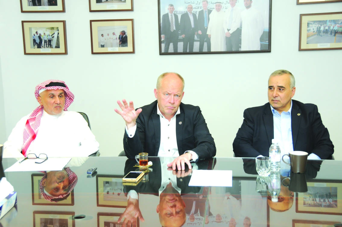 Volvo Trucks President Claes Nilsson gestures during an interview with Arab News at the King Abdullah Economic City in Rabigh on Tuesday. He is flanked by Amr M. Khashoggi, vice president of human resources and group affairs at Zahid Tractor, left, and Nasser Jamil Bayram, director
of Zahid Tractor’s commercial vehicles division. (AN photo)