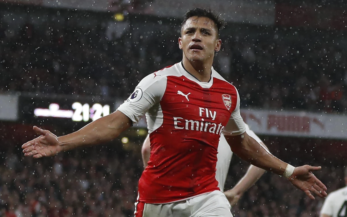 Arsenal's Chilean striker Alexis Sanchez celebrates after scoring the second goal during the English Premier League football match between Arsenal and Sunderland at the Emirates Stadium in London on Tuesday. (AFP)