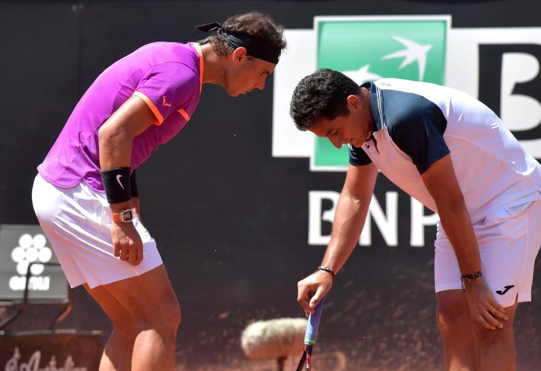 Rafael Nadal of Spain,left, talks with fellow Spaniard Nicolas Almagro, who was forced to quit after an injury during their match at the ATP Rome Masters tournament on Wednesday at the Foro Italico in Rome. (AFP)