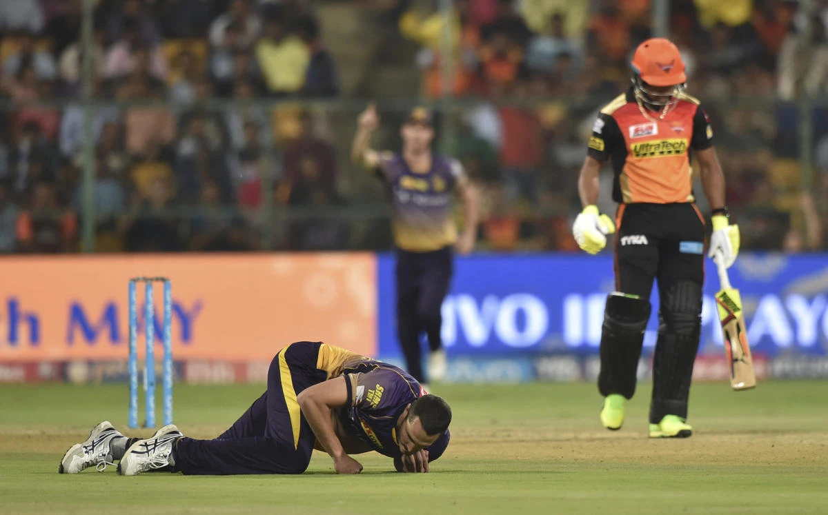 Kolkata Knight Riders' Nathan Coulter Nile, on ground, takes a catch to dismiss Sunrisers Hyderabad batsman Chris Jordan during the Indian Premier League cricket eliminator match in Bangalore, India, Wednesday. (AP)
