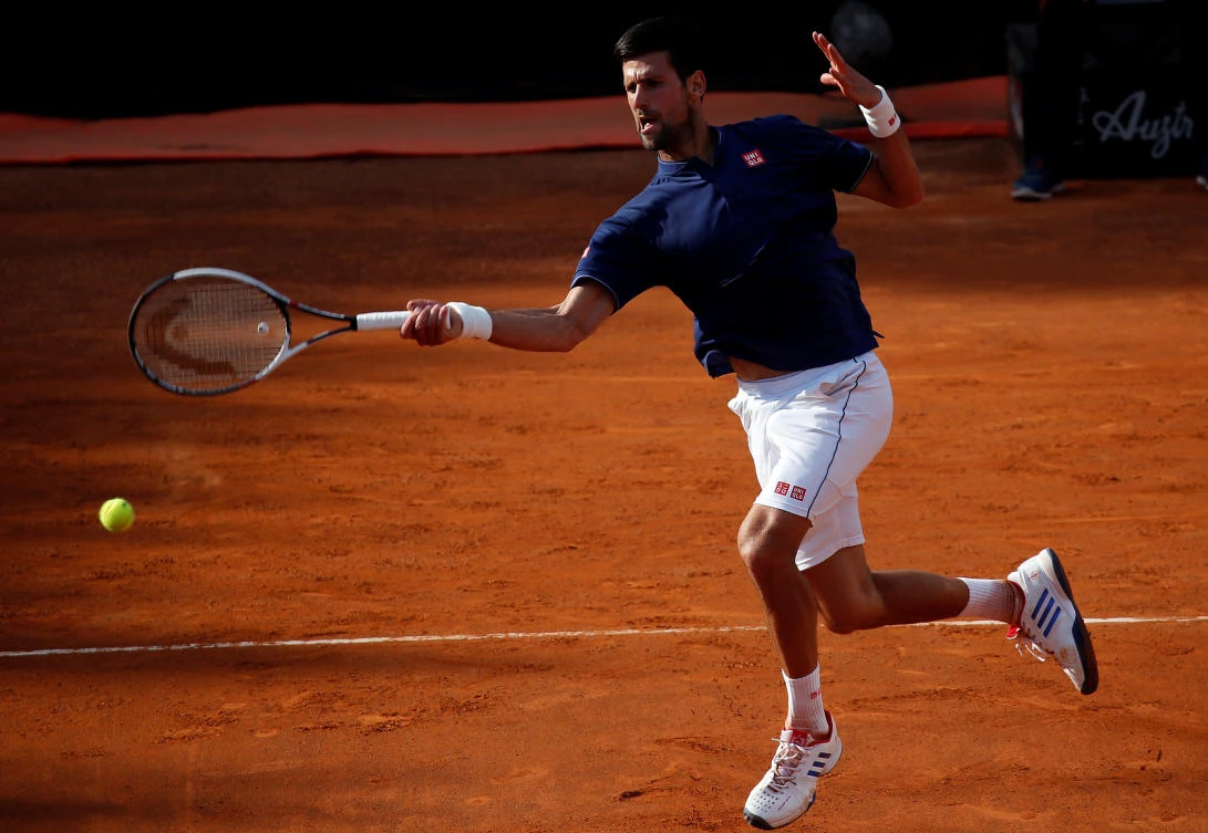 Novak Djokovic of Serbia returns the ball to Roberto Bautista Agut of Spain during their match Thursday in the Rome Masters tennis tournment.