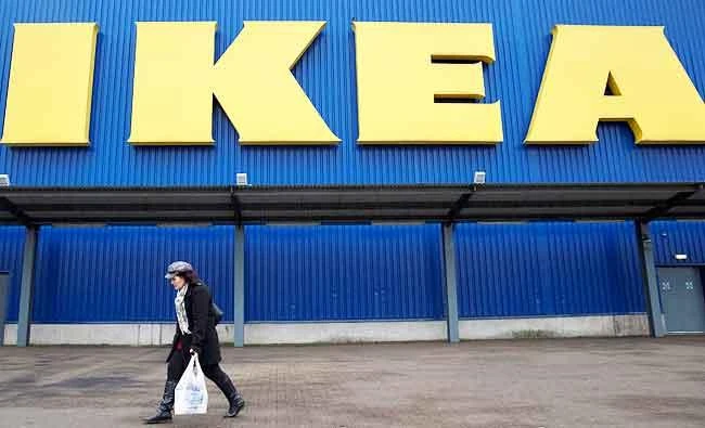 A shopper walks past a sign outside an IKEA store in Wembley, north London, in this January 28, 2015 file photo. (REUTERS)