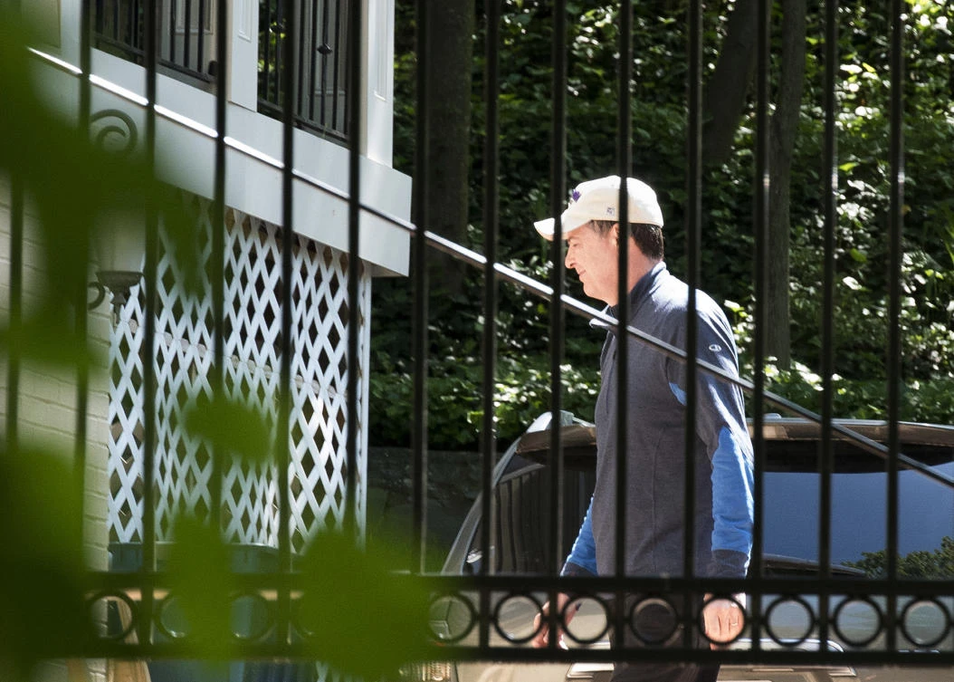 Former FBI Director James Comey walks at his home in McLean, Virginia. Trump says he is close to naming his replacement. (AP)