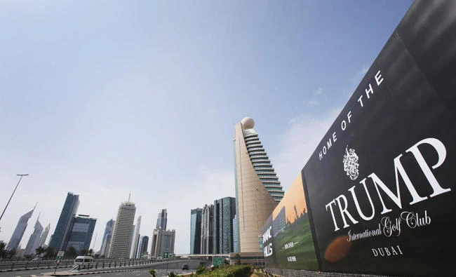 A giant billboard advertising the Trump International Golf Club hangs at the Dubai Trade Center roundabout, in Dubai, pictured in February. (AP Photo)
