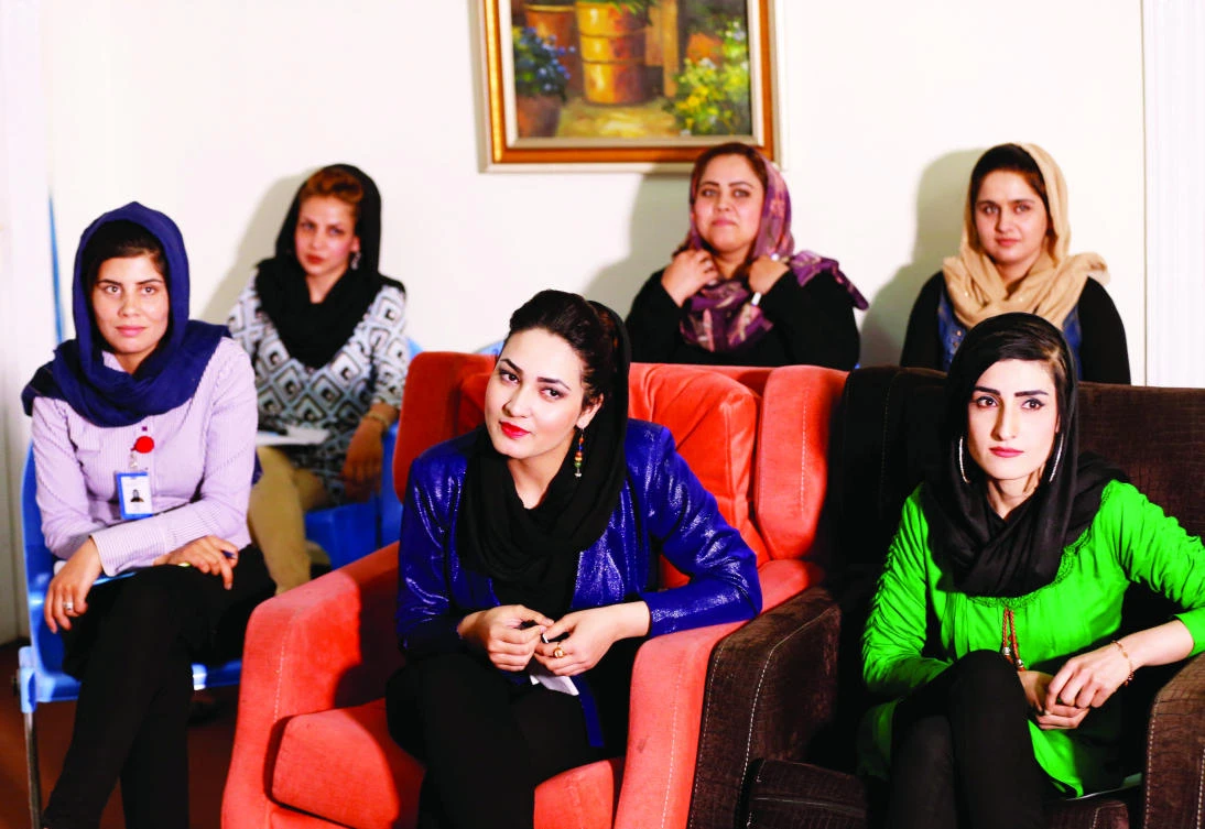 Employees attend a meeting at the Zan TV studio in Kabul. (Reuters)