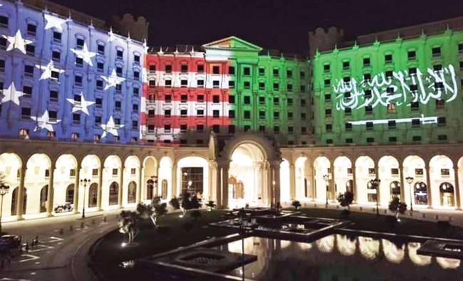 Ritz Carlton Hotel in Riyadh is illuminated in colors of the national flags of Saudi Arabia and the US.