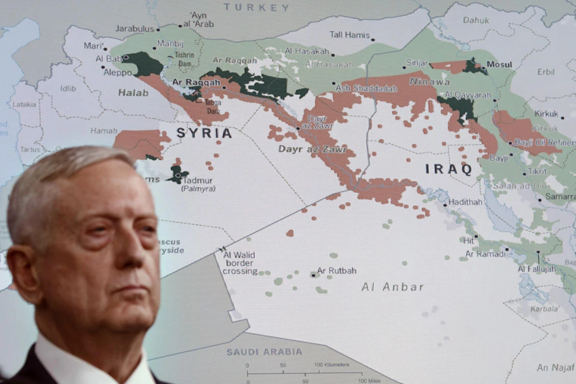 Defense Secretary Jim Mattis stands in front of a map of Syria and Iraq during a news conference at the Pentagon on Friday to give an update on the Daesh group. (AP Photo/Jacquelyn Martin)