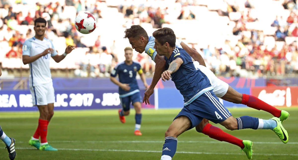England's Dominic Calvert-Lewin, second from right, heads the ball to score a goal as Argentina's Gonzalo Montiel defends during their Group A match in the FIFA U-20 World Cup Korea 2017 at Jeonju World Cup Stadium in Jeonju, South Korea, Saturday. (AP)