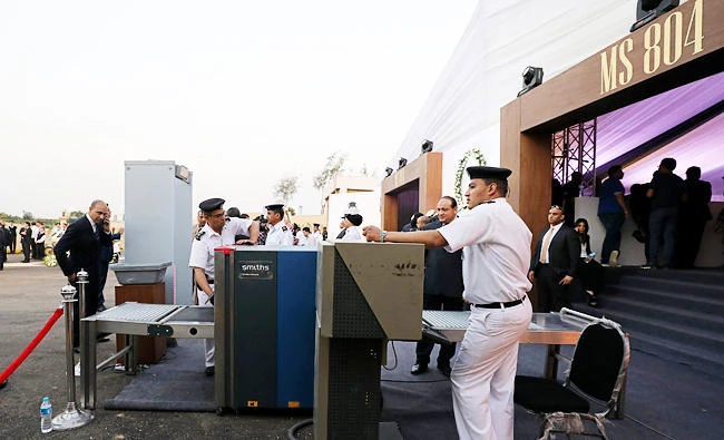 The Egyptian policemen secure the electronic gates that lead to hall of memorial of Egypt air flight MS804 victims in the Ministry of Aviation at Cairo airport in Cairo, Egypt on Friday. (REUTERS)