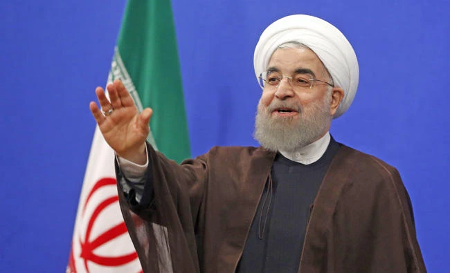 Newly re-elected Iranian President Hassan Rouhani gestures during a televised speech in Tehran on Saturday. (AFP / ATTA KENARE)