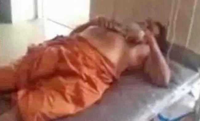 A screen grab from video shared on social media shows Indian holy man Gangeshananda Theerthapada being treated at a hospital after a young woman severed his genitals on Saturday in Thiruvananthapuram, the capital of Kerala state capital.