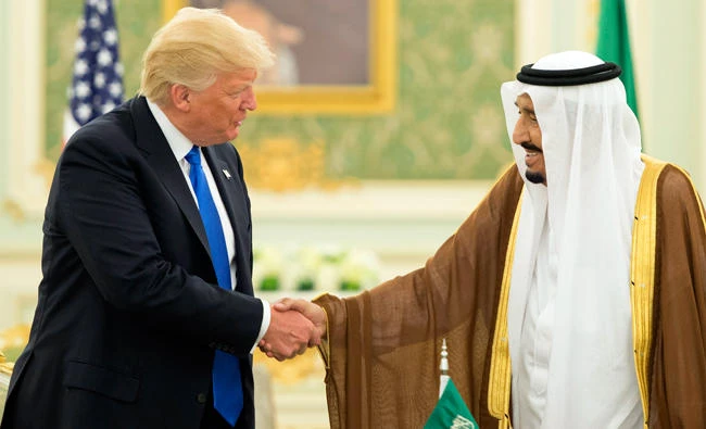 A handout photo provided by the Saudi Royal Palace on May 20, 2017, shows US President Donald Trump (L) and Saudi Arabia's King Salman bin Abdulaziz al-Saud shaking hands during a signing ceremony at the Saudi Royal Court in Riyadh. (AFP)
