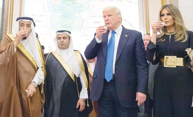 King Salman enjoyed a cup of Saudi traditional coffee with US President Donald Trump and the US First Lady Melania Trump in Riyadh on Saturday. (SPA)