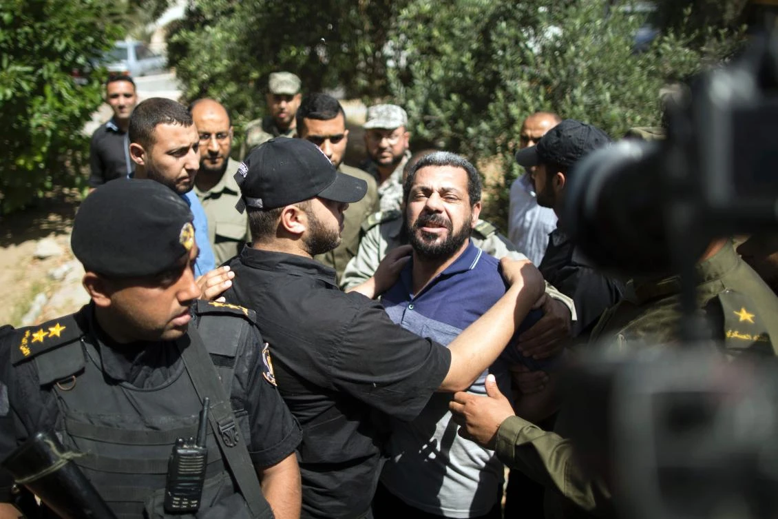 Hamas security forces escort Hisham Al-Aloul (C), a 44-year-old Palestinian man convicted of the murder of Hamas military commander Mazen Faqha, out of the military court in Gaza City May 21, 2017. (AFP)