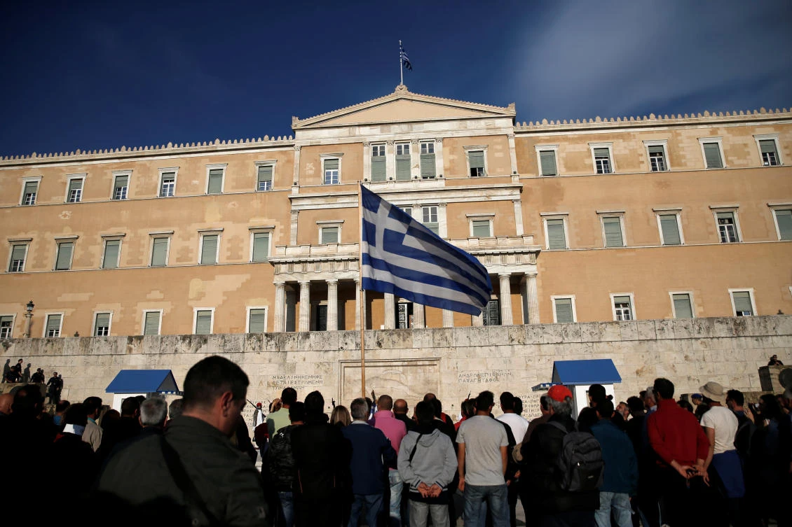 The Greek Parliament late Thursday adopted a new round of austerity cuts which the government hopes will secure a pledge of debt relief and loan disbursements by EU-IMF creditors. (Reuters)