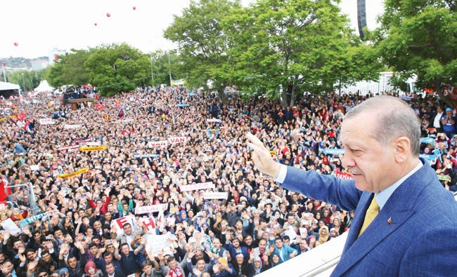 Turkey’s President Recep Tayyip Erdogan waves to supporters as he arrives for a congress of the ruling Justice and Development Party in Ankara on Sunday. (AP)