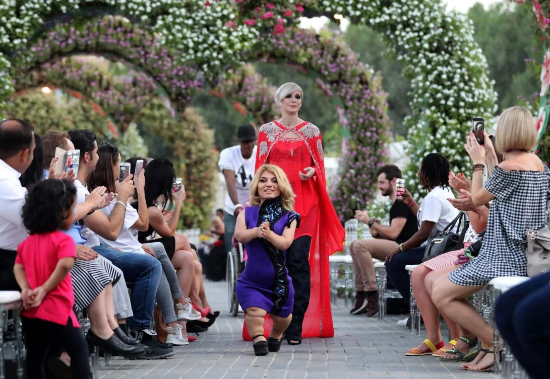 A model walks down the catwalk during the International Dwarf Fashion Show as part of the Arab Fashion Week in Dubai. (AFP)