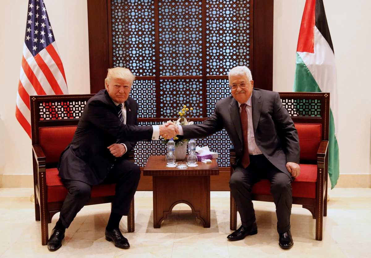 President Donald Trump shakes hands with Palestinian President Mahmoud Abbas during their meeting at the presidential headquarters in the West Bank town of Bethlehem. (REUTERS)