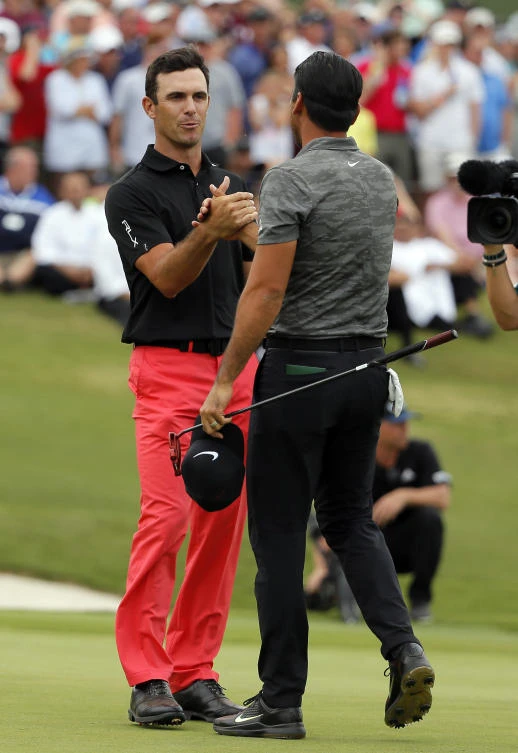 Billy Horschel, left, and Jason Day, right, of Australia, shake hands after their playoff round in the Byron Nelson golf tournament Sunday in Irving, Texas. Horschel won the tournament. (AP)