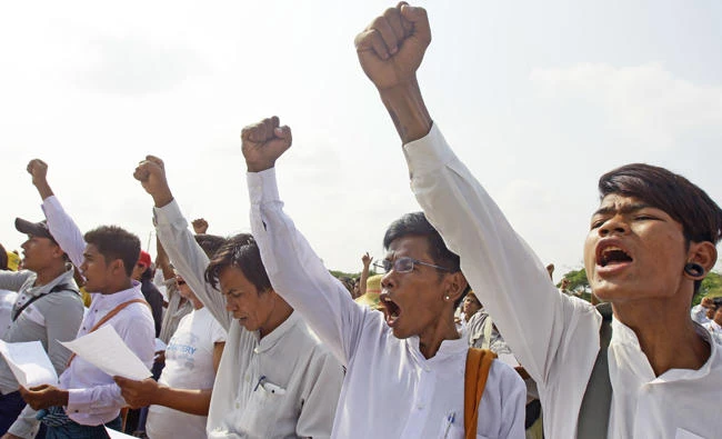 Members of a Myanmar's ultra-nationalist Buddhist group shout slogans during a protest rally in Nayptitaw, Myanmar, on May 20, 2017, against Religious Minister Thura Aung Ko for his intervention in a case in which Myanmar Now news chief reporter Swe Win leveled allegations against Wirathu, a high-profile leader of the Myanmar Buddhist organization known as Ma Ba Tha, after the monk praised the assassination in January of prominent Muslim lawyer Ko Ni who was a legal advisor to Aung San Suu Kyi's government. (AP Photo/Aung Shine Oo)