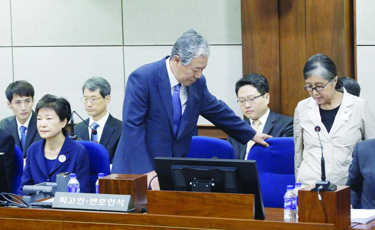 Former South Korean President Park Geun-hye sits as her longtime friend Choi Soon-sil arrives for her trial at the Central District Court in Seoul. (Reuters)