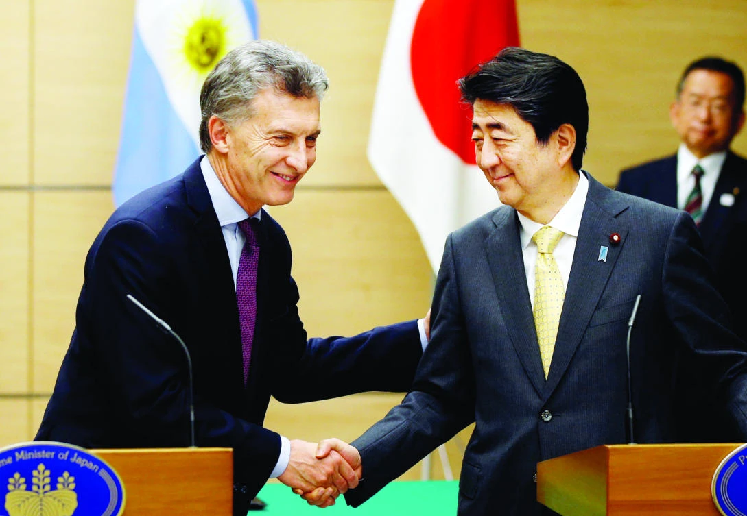 Japan’s Prime Minister Shinzo Abe greets Argentina’s President Mauricio Macri during a recent news conference in Tokyo. (Reuters)