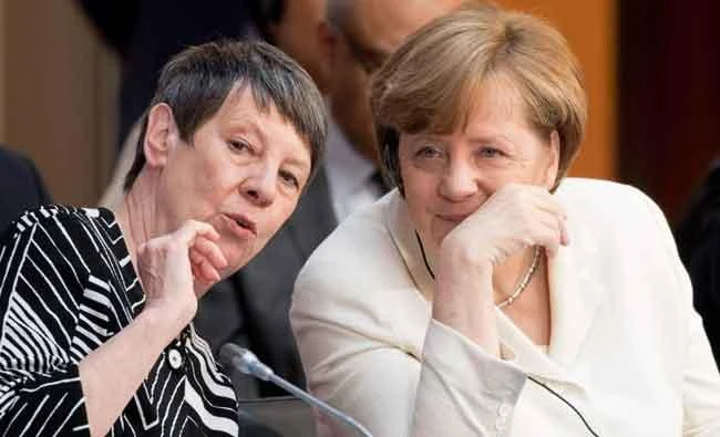 German Chancellor Angela Merkel (R) talks with German Environment Minister Barbara Hendricks on Tuesday in Berlin at the Petersberg Climate VIII Dialogue event. (AFP)