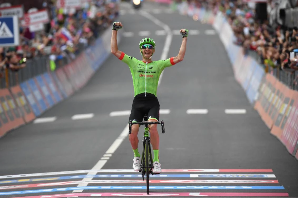 French rider Pierre Rolland celebrates as he crosses the finish line to win the 17th stage of the Giro d'Italia cycling race, from Tirano to Canazei, Italy, Wednesday. (AP)